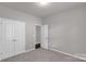 A cozy bedroom featuring carpeted floors and ample closet space at 1923 Caprington Dr, Fort Mill, SC 29707