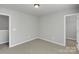 Cozy bedroom features neutral carpet and calming gray walls, great for relaxing at 1923 Caprington Dr, Fort Mill, SC 29707