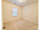 Cozy bedroom with neutral carpet and a window providing natural light at 1923 Caprington Dr, Fort Mill, SC 29707