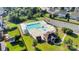 Aerial view of community pool area with lounge chairs, ample parking, and a recreation building at 1923 Caprington Dr, Fort Mill, SC 29707