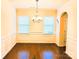 Elegant dining room featuring hardwood floors, classic wainscoting, and a stylish chandelier at 1923 Caprington Dr, Fort Mill, SC 29707