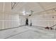 Spacious unfinished garage showcasing a concrete floor and ample space at 1923 Caprington Dr, Fort Mill, SC 29707