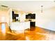Bright open kitchen with stainless steel appliances, granite counters, and hardwood floors at 1923 Caprington Dr, Fort Mill, SC 29707