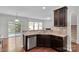 Modern kitchen with stainless steel appliances and granite countertops open to living space at 1923 Caprington Dr, Fort Mill, SC 29707