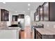 Open kitchen featuring stainless steel appliances, granite countertops, and dark cabinetry at 1923 Caprington Dr, Fort Mill, SC 29707