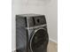 Laundry room showcasing a modern, front-load washing machine at 1923 Caprington Dr, Fort Mill, SC 29707