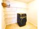 Convenient laundry room with a modern washer and organized shelving for easy storage at 1923 Caprington Dr, Fort Mill, SC 29707
