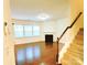 Bright living room with hardwood floors, a fireplace, and staircase at 1923 Caprington Dr, Fort Mill, SC 29707