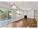 Cozy living room with hardwood floors, fireplace, and sliding door access to outdoor patio at 1923 Caprington Dr, Fort Mill, SC 29707