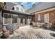 Expansive back deck featuring ample seating, offering a serene outdoor retreat with seamless indoor-outdoor flow at 25 Blenheim Ne Ct, Concord, NC 28025