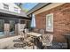 Charming back deck with dining set, perfect for outdoor meals and relaxing in the shade of the umbrella at 25 Blenheim Ne Ct, Concord, NC 28025