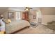 Charming bedroom with wooden accents and lots of natural light at 25 Blenheim Ne Ct, Concord, NC 28025