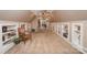 Spacious bonus room with neutral paint and built-in shelving at 25 Blenheim Ne Ct, Concord, NC 28025