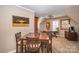 Bonus room with wood table, ceiling fan, and natural light at 25 Blenheim Ne Ct, Concord, NC 28025