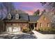 Beautiful brick home with dormer windows, attached garage, and landscaped yard at 25 Blenheim Ne Ct, Concord, NC 28025