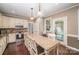 Well-lit kitchen featuring a center island with seating, stainless steel appliances, and sleek design at 25 Blenheim Ne Ct, Concord, NC 28025