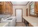 Laundry room with wooden cabinets and a side countertop at 25 Blenheim Ne Ct, Concord, NC 28025