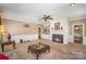 Comfortable living room includes a fireplace, built-ins, and traditional-style furnishings at 25 Blenheim Ne Ct, Concord, NC 28025