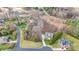 Aerial shot of the property showcasing its location, surrounding landscape, and proximity to a golf course and lake at 2846 Snead Ne Ct, Conover, NC 28613