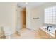 Bright bathroom features a tile shower, soaking tub, and toilet at 2846 Snead Ne Ct, Conover, NC 28613