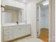 Bathroom featuring a white vanity and open door leading to a walk-in closet at 2846 Snead Ne Ct, Conover, NC 28613