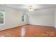 Bedroom featuring hardwood floors, two windows, and a ceiling fan at 2846 Snead Ne Ct, Conover, NC 28613