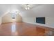 Spacious bonus room featuring hardwood floors, vaulted ceilings, and a window offering natural light, perfect for entertainment at 2846 Snead Ne Ct, Conover, NC 28613