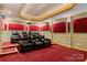 Luxurious home theater featuring tiered seating, plush leather recliners, and ambient lighting for an immersive viewing experience at 2846 Snead Ne Ct, Conover, NC 28613