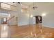 Open living room with high ceilings, hardwood floors, and a view of the foyer and staircase at 2846 Snead Ne Ct, Conover, NC 28613