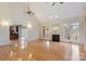 Spacious living room with hardwood floors, a fireplace, large windows, and an open layout to the kitchen at 2846 Snead Ne Ct, Conover, NC 28613