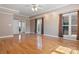 Spacious main bedroom features hardwood floors, tray ceiling, and large windows with natural light at 2846 Snead Ne Ct, Conover, NC 28613
