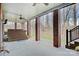 Covered patio with brick columns, ceiling fans, hot tub, and outdoor space for relaxation and entertainment at 2846 Snead Ne Ct, Conover, NC 28613