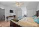This bedroom has plenty of closet space, light wood floors and a mounted television at 311 S Cedar St # C, Lincolnton, NC 28092