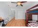Nicely lit bedroom with closet, adjacent doorway and a bunk bed with a wood frame at 311 S Cedar St # C, Lincolnton, NC 28092