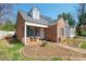 Charming brick home featuring a dormer window, blue shutters and small front porch at 311 S Cedar St # C, Lincolnton, NC 28092
