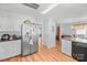 Kitchen with stainless steel refrigerator, white cabinets and open sight lines at 311 S Cedar St # C, Lincolnton, NC 28092