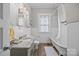 Bright bathroom with white subway tile, granite vanity, and a classic clawfoot tub at 329 N Ellis St, Salisbury, NC 28144