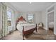 Comfortable bedroom with decorative window treatments, wood floor and antique style furniture at 329 N Ellis St, Salisbury, NC 28144