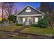 Charming renovated home with inviting front porch, manicured lawn, and classic architectural details at 329 N Ellis St, Salisbury, NC 28144