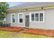 Inviting home entrance featuring tidy landscaping, a neatly maintained walkway, and a classic front door at 329 N Ellis St, Salisbury, NC 28144