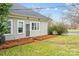 Charming home with tidy yard, lush shrubbery, and well-maintained exterior. with easy street access at 329 N Ellis St, Salisbury, NC 28144