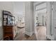 Entryway featuring hardwood floors, vintage furniture, and open flow to the living and dining areas at 329 N Ellis St, Salisbury, NC 28144