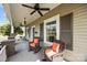 Spacious covered front porch with ceiling fans and wicker rocking chairs offers a relaxing outdoor space at 329 N Ellis St, Salisbury, NC 28144
