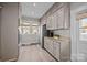 Well-equipped kitchen featuring ample cabinetry, stainless steel appliances, granite countertops, and hardwood floors at 329 N Ellis St, Salisbury, NC 28144