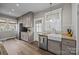 Kitchen with granite countertops, stainless steel appliances, ample cabinetry, and hardwood floors at 329 N Ellis St, Salisbury, NC 28144
