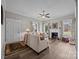 Bright living room boasts hardwood floors, a fireplace, natural light, and cozy furnishings at 329 N Ellis St, Salisbury, NC 28144