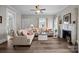 Cozy living room with hardwood floors, a fireplace, and comfortable seating for relaxing and entertaining at 329 N Ellis St, Salisbury, NC 28144