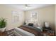 Staged bedroom with a cozy bed and decorative lamps on each bedside table at 343 Wakefield Dr # B, Charlotte, NC 28209
