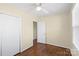 Comfortable bedroom with hardwood floors and a view to an adjoining room at 343 Wakefield Dr # B, Charlotte, NC 28209