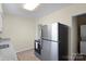 Functional kitchen view showcasing stainless steel appliances, stone counters, and neutral flooring at 343 Wakefield Dr # B, Charlotte, NC 28209